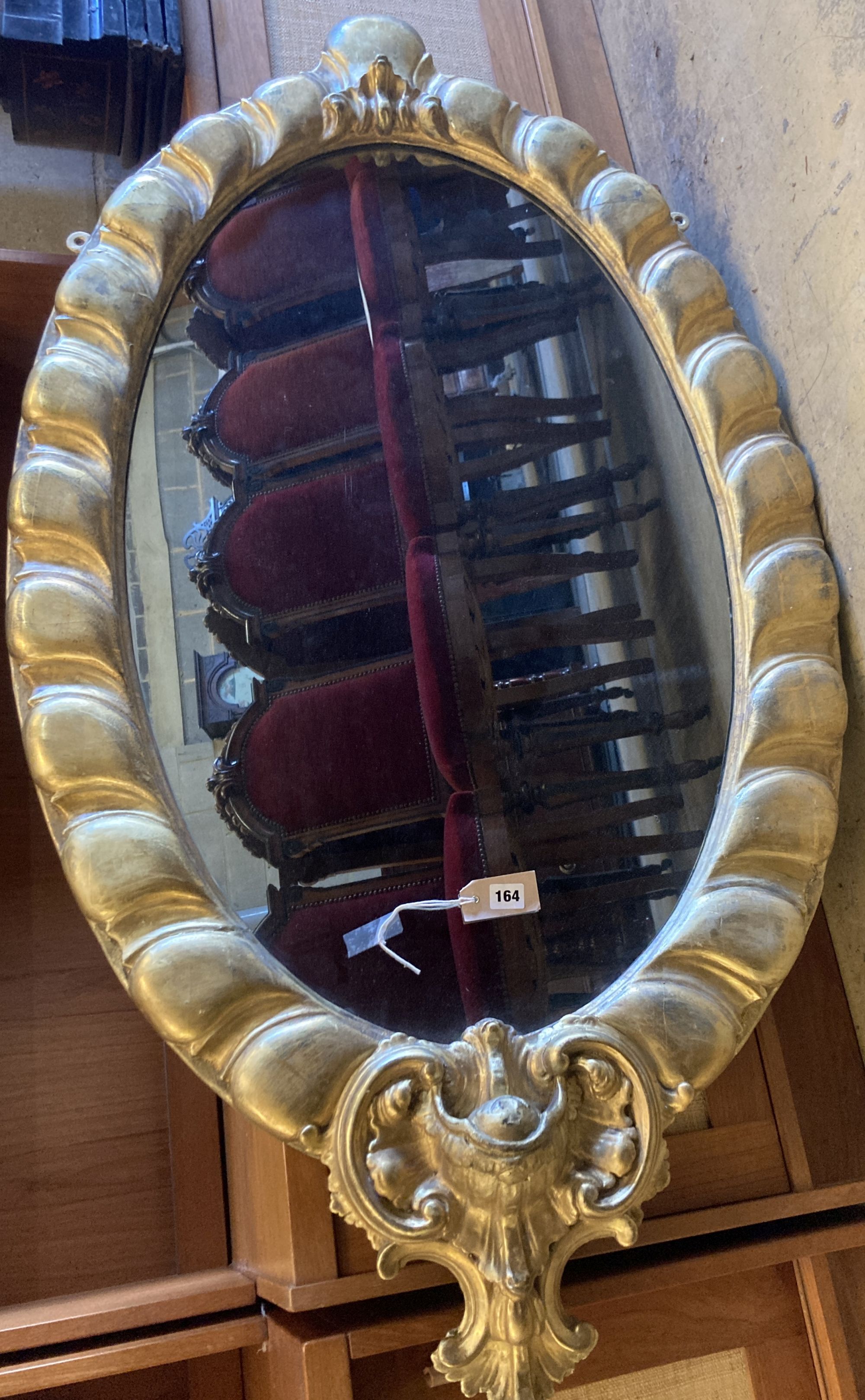 A Victorian oval giltwood and gesso wall mirror, width 80cm, height 152cm